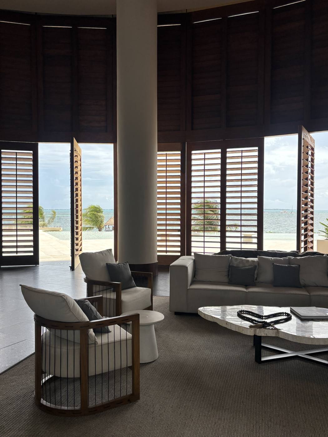 The open-air lobby, with wooden shutters that open onto the sea